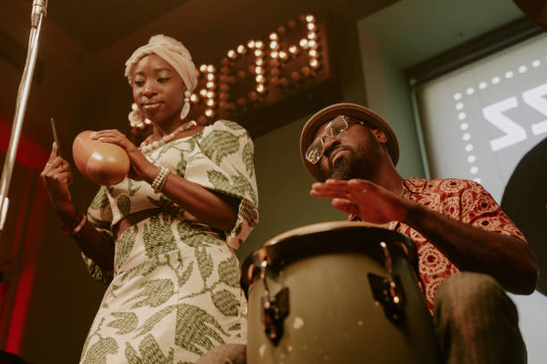 istock Man And Woman Playing Percussion Instruments 2169814682