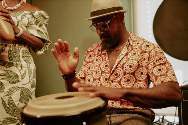 istock Black Man Playing Conga Instrument 2169814780
