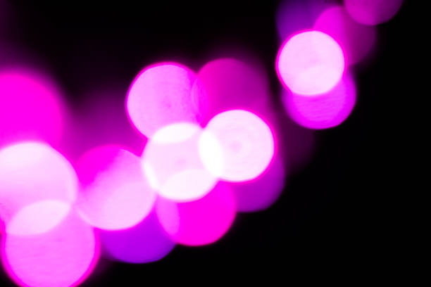 Blurred lights with purple bokeh effect Background