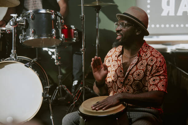 istock Man Playing Tumbadora And Singing 2169815198
