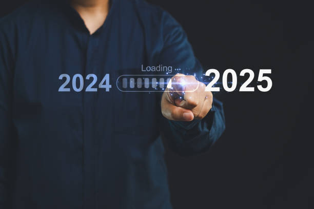 istock Finger touching digital progress bar - Transition from 2024 to 20250. 2169816373