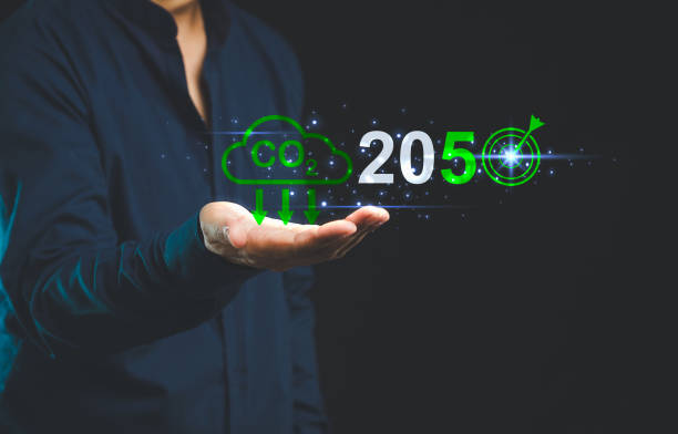 istock Business vision for 2050 CO2 reduction goals displayed in hand. 2169816477