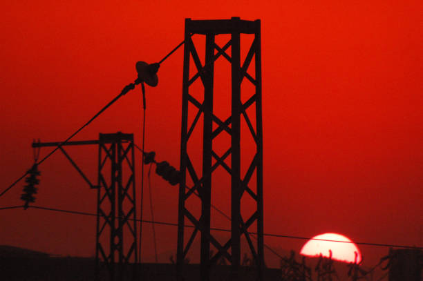 The setting sun shines on the cable tower