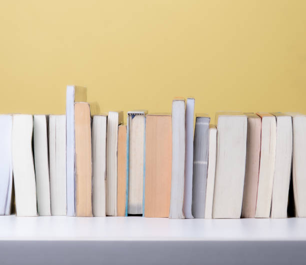 istock Books on the shelf,yellow background 2169819510