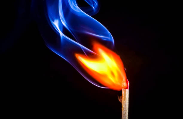 istock fire and smoke as match catches alight and burns bright 2169819687