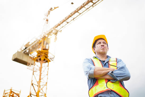 istock Careless worker at construction site without wearing helmet. 2169820030
