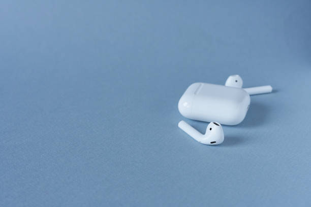 istock Earphones on a blue background with copy space. Music concept. 2169821210
