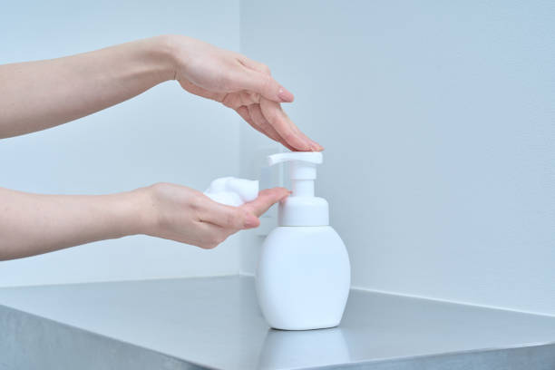 istock A woman washing her hands with hand soap 2169821270