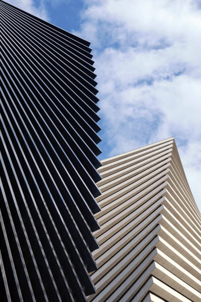 istock Two beautiful modern office skyscrapers against the sky. 2169822668