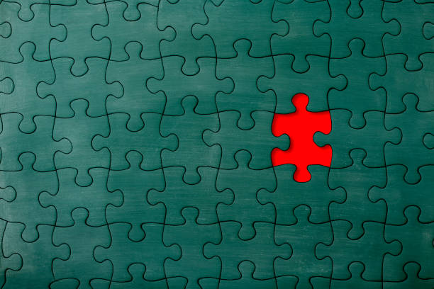 Close-up of missing piece of a jigsaw puzzle made from chalkboard.