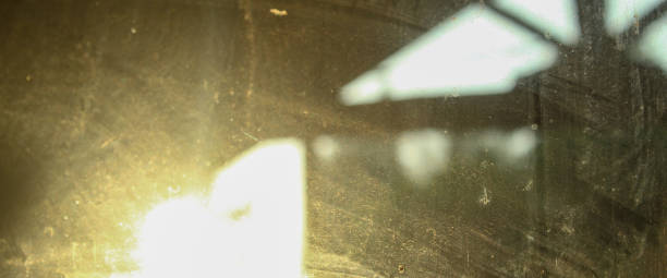 istock blur abstract glass window with sunlight. blur glass with yellow light 2169825732