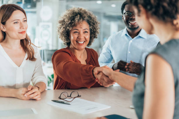 istock Shaking hands with new colleague 2169827286