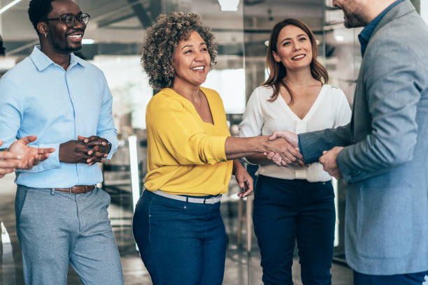 istock Business people shaking hands in the office 2169827290