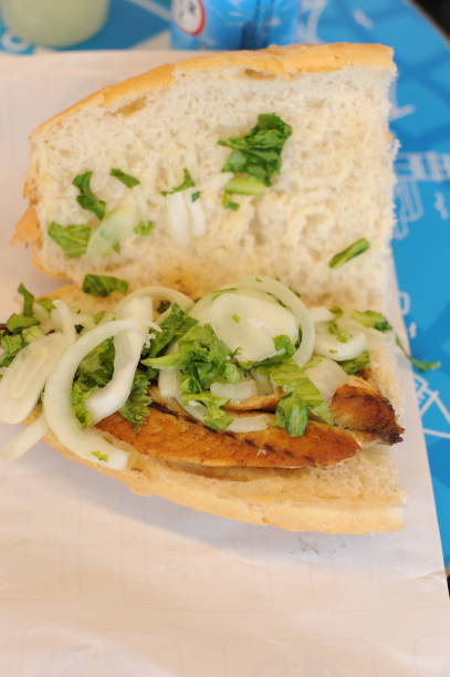 istock Fish sandwhich with grilled mackarel, raw onion in white wheat bread roll. Delicious taste from Turkey 2169828811