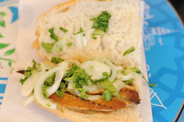 istock Fish sandwhich with grilled mackarel, raw onion in white wheat bread roll. Delicious taste from Turkey 2169828815