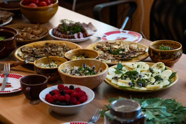 A table filled with various homemade Baltic dishes and fresh ingredients, ready to be served.