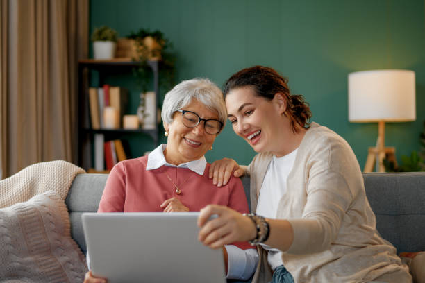 istock Young and senior women are using laptop 2169831868