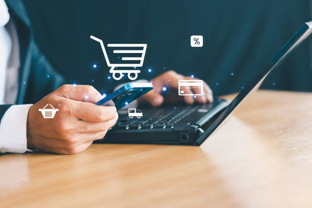 istock Businessman using mobile phone to buy things online e-commerce business concept 2169831891
