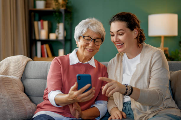 istock Young and senior women are using smartphone 2169832161