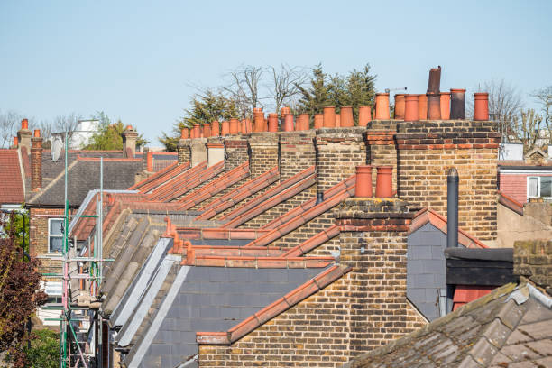 istock Brick chimneys and rooftop in Victorian terraced houses 2169833023