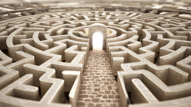 istock Intricate labyrinth structure with stone pathway leading to a glowing exit in a surreal environment 2169833719