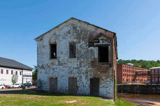 Prattville, Alabama, USA-April 19, 2023: Side view of historic Picker House originally built in 1850. It survived a fire that consumed adjacent structures of Prattville Manufacturing Company in 2002.