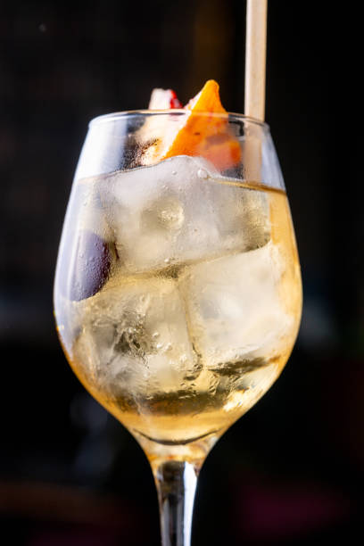 istock Peach cocktail in glass on dark background 2169835209