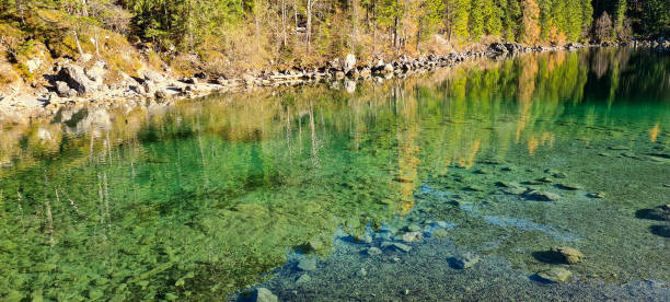 istock Autumn in crystal clear Eibsee coast. 2169836579