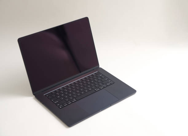 istock Side view of laptop with blank screen isolated on white background. Selective focus. 2169836608
