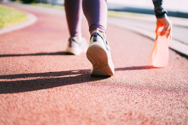 istock Rear view of runner shoes on a running track. 2169836730