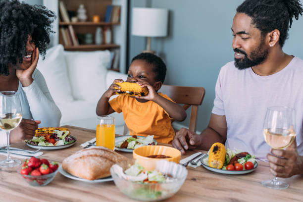 istock Young family enjoying lunch together. 2169836830