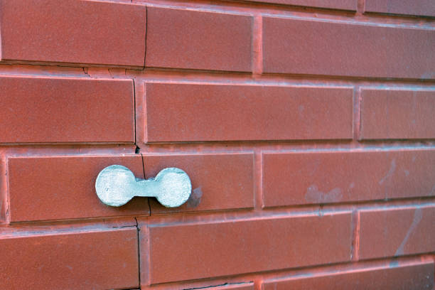 istock external concrete overlay applied to a cracked brick wall, representing a practical repair solution to enhance structural integrity and aesthetic appeal 2169836877