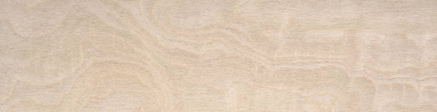 Subtle interplay of light beige and cream swirls in a delicate wood grain pattern, suggesting natural elegance and simplicity