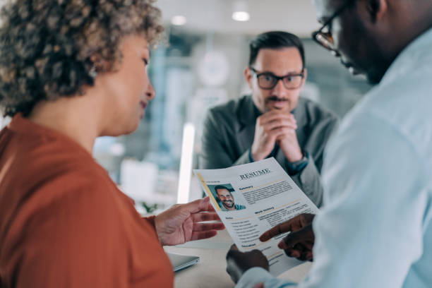 istock Confident male applicant talking at job interview answering questions. 2169837347