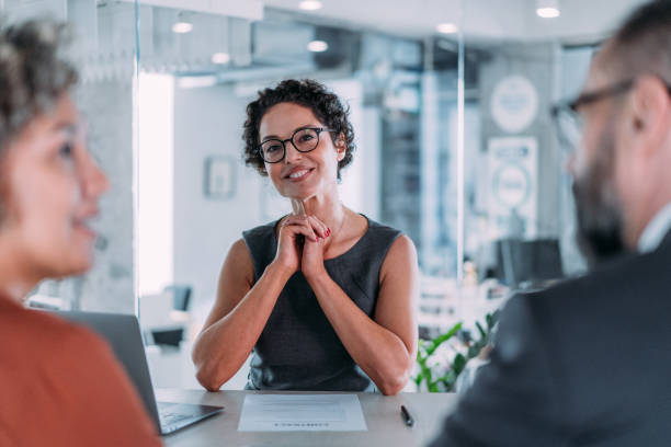 istock Group of business persons talking in the office. 2169837381