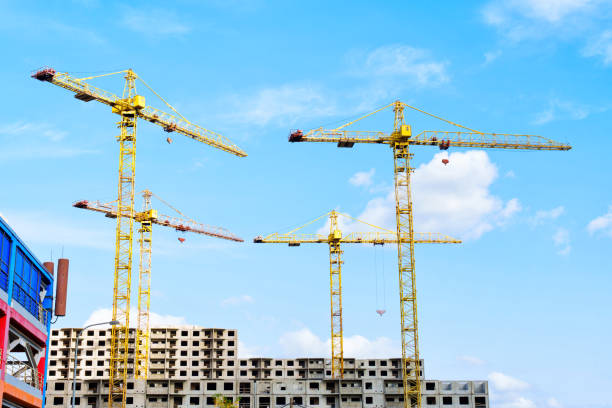 istock Construction Site With Yellow Cranes Against Clear Blue Sky 2169837385