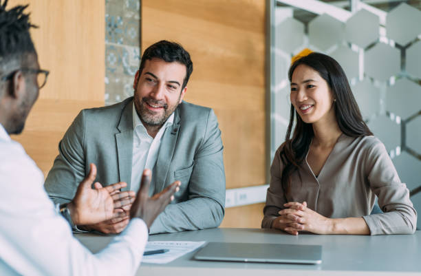 istock Group of business persons talking in the office. 2169837621