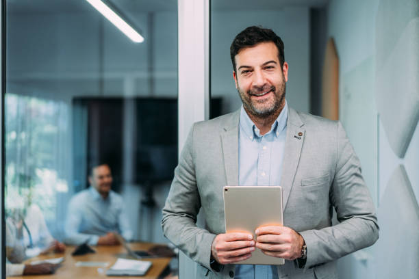 istock Confident businessman and his team. 2169837709