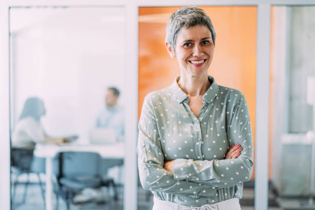 istock Confident businesswoman and her team. 2169837758