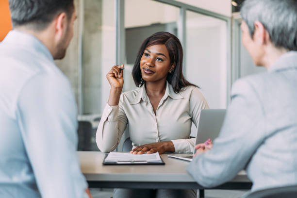 istock Group of business persons talking in the office. 2169837768