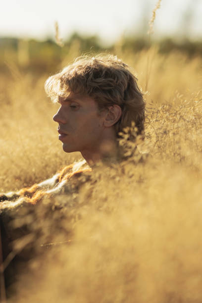 istock Blonde man in sweater. Autumn nature 2169841659
