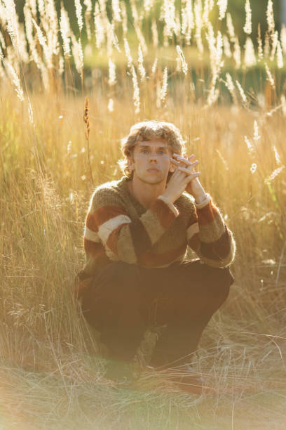 istock Blonde man in sweater. Autumn nature 2169841964