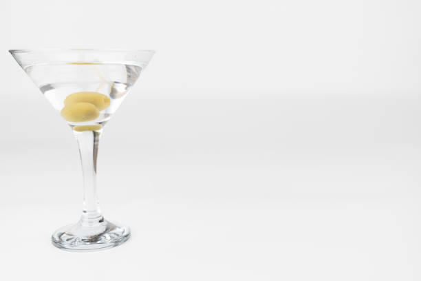 istock Martini Glass with Olives on Simple White Background 2169843165