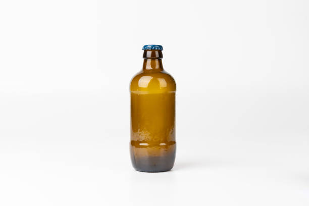 istock Centered brown glass beer bottle against a white background, horizontal orientation, highlighting simplicity and minimalism in the product shot 2169843466