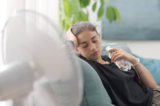 istock Exhausted woman suffering from the heat 2169849542