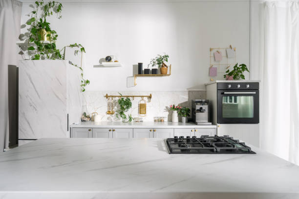 istock A modern kitchen with plants, bright lighting, and a marble countertop in a stylish home setting 2169849654