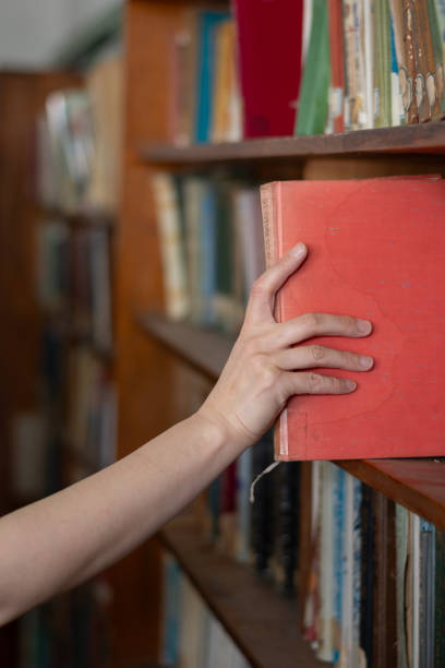 istock Take a book from the shelf 2169853279