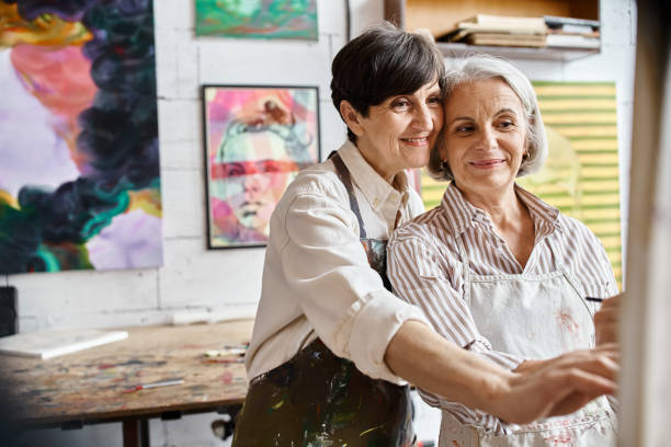 istock A creative moment between a mature lesbian couple in their vibrant art studio 2169854639