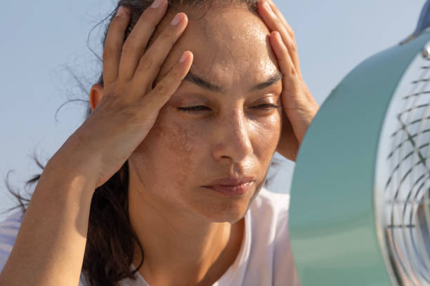 istock Woman with Fan 2169855394