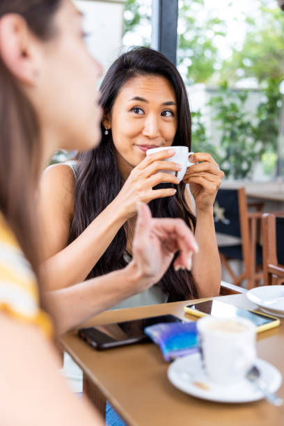 istock Two women best friends enjoying a coffee break 2169865158